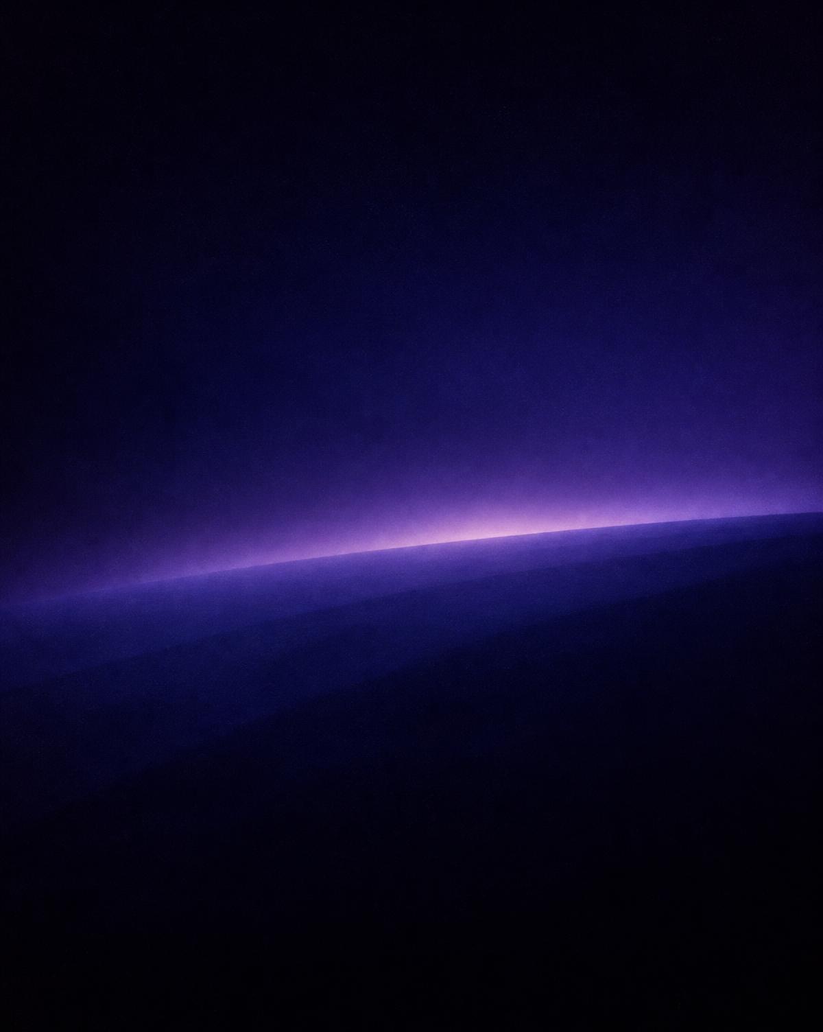 Faint violet planetary horizon glow